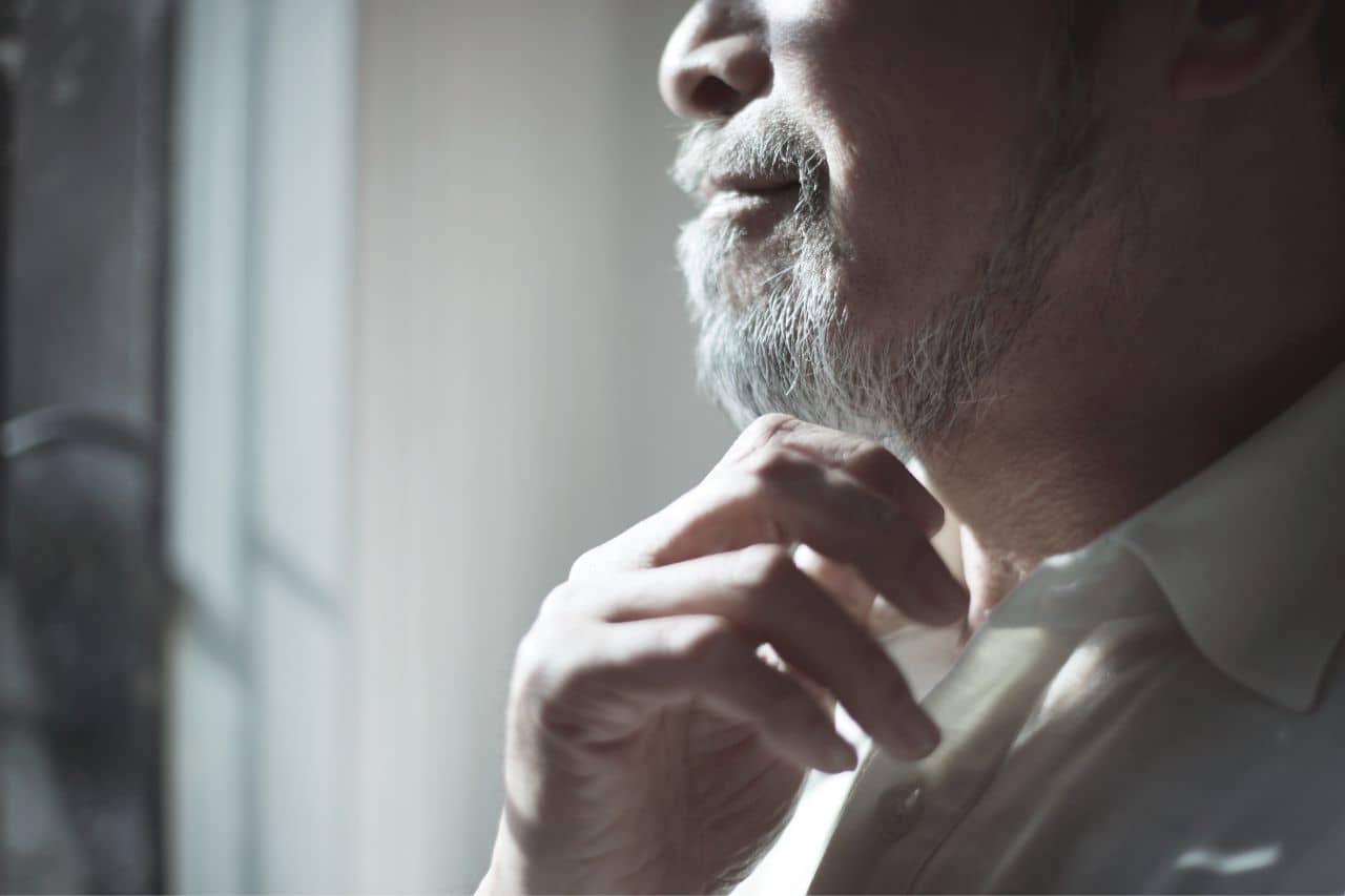 	Bearded man scratching his chin