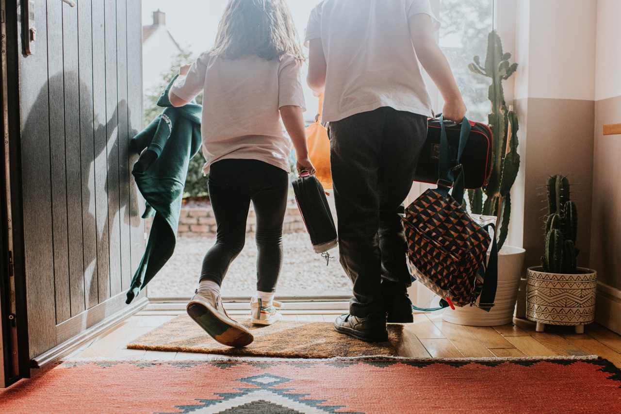 Two children leaving for school