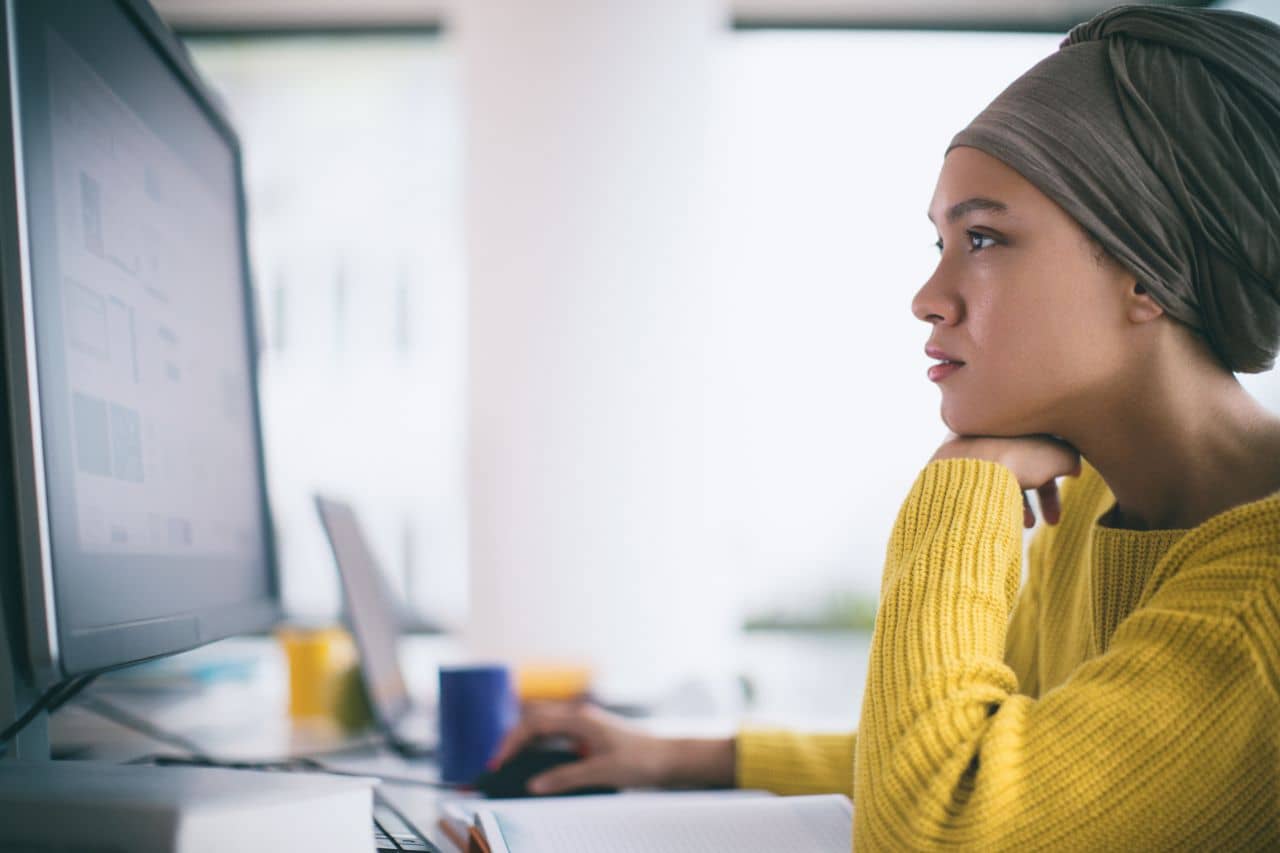 Woman looking at test results on a computer