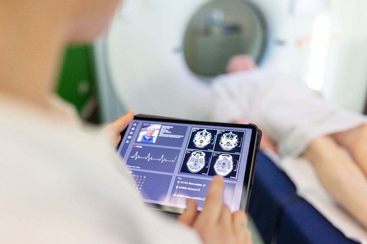 Doctor looking at MRI scan on a tablet