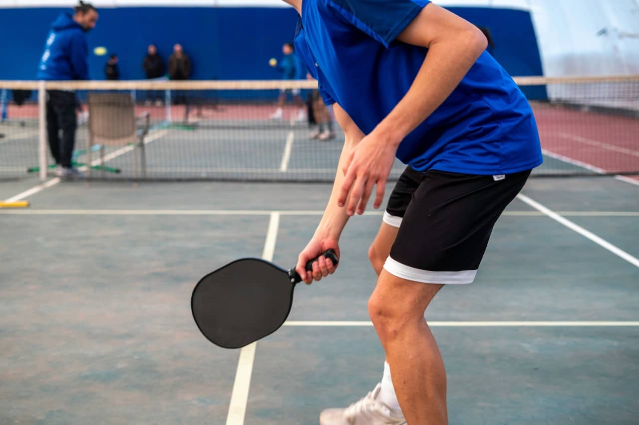 Person playing pickleball Tendonitis