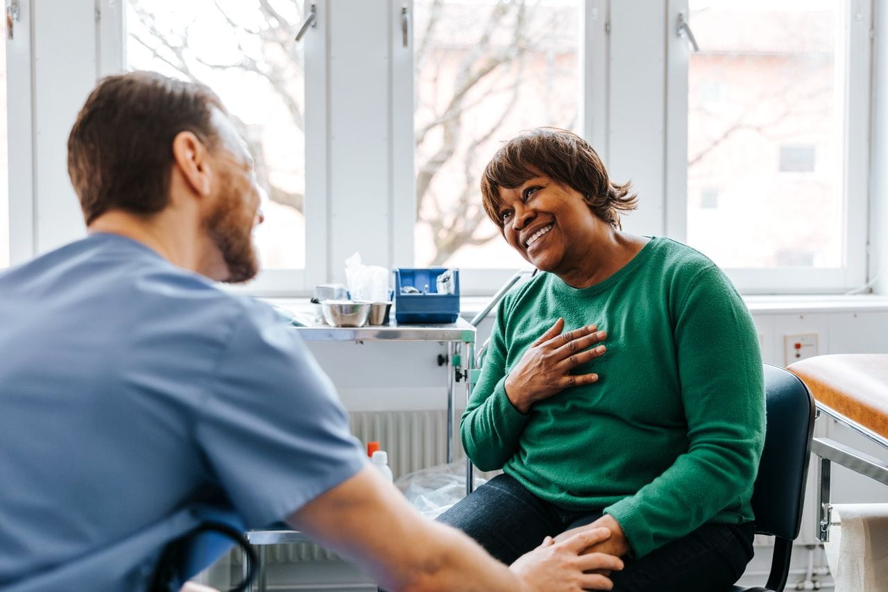 Patient talking with a doctor in a medical setting