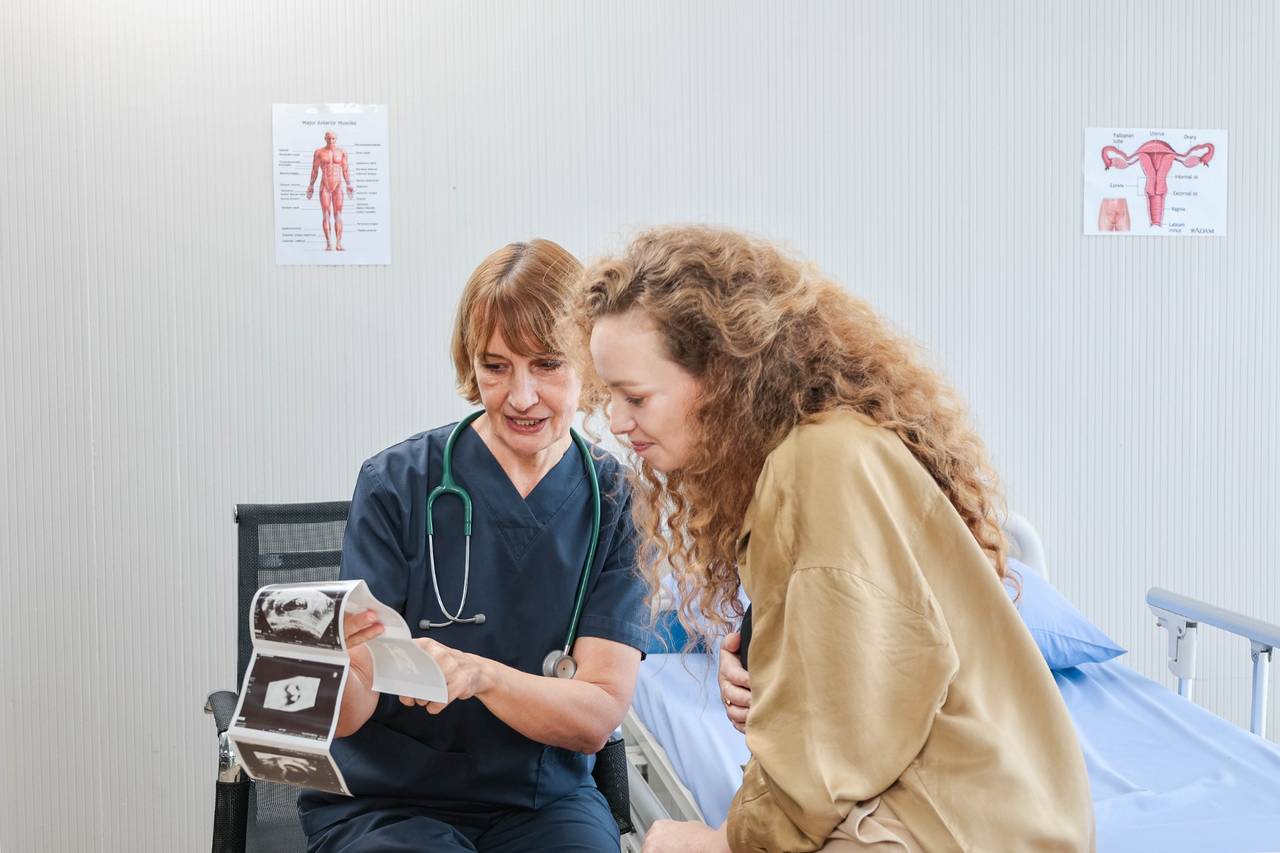 Doctor and patient looking at ultrasound results