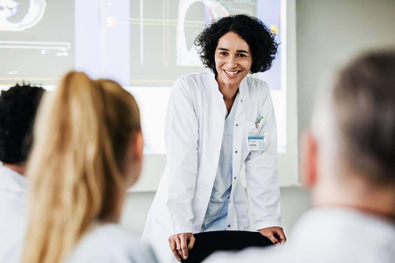 Woman doctor teaching others