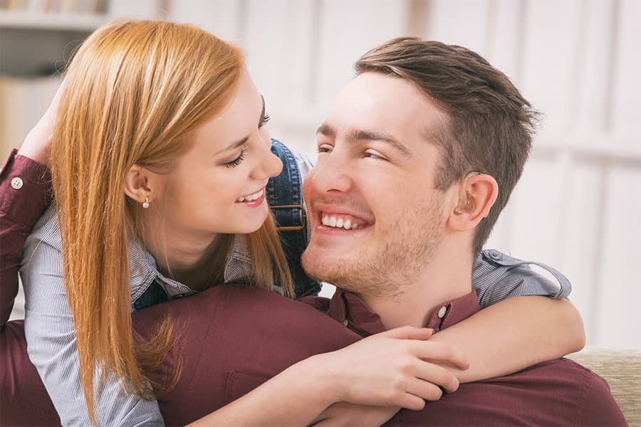 Woman and Man hugging and smiling